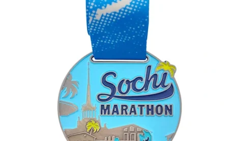 Custom marathon medal with colorful city skyline and blue ribbon
